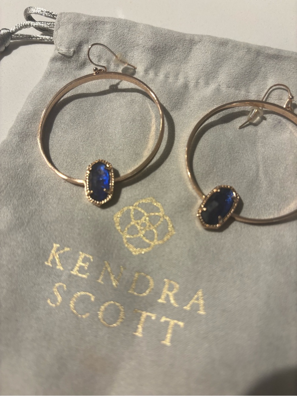 Kendra Scott Gold Hoop Earrings with Deep Blue Stone